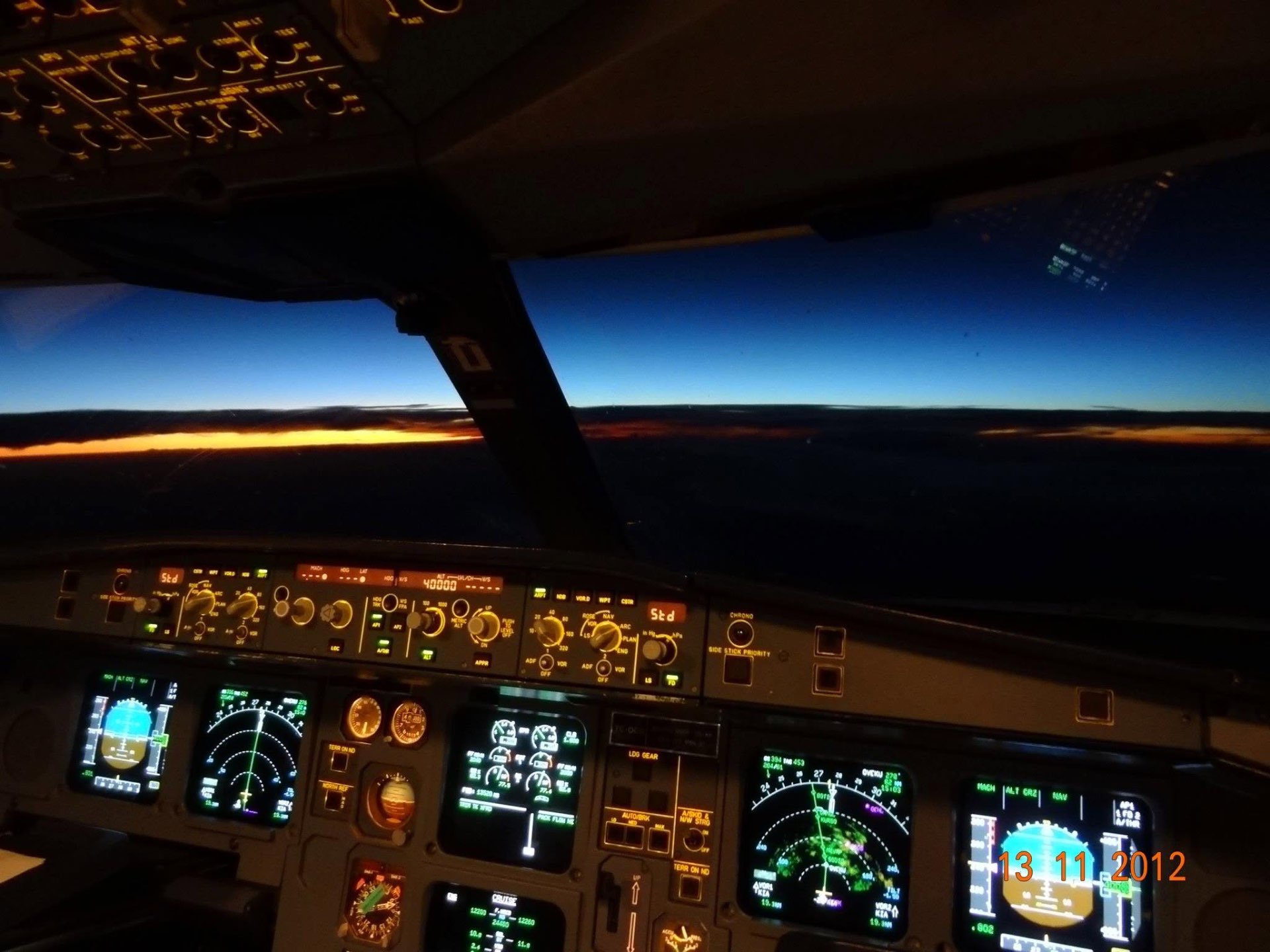 View from an airliner cockpit at 40,000 feet during sunset